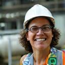 Worker in ethical-certified plant with compliance badge
